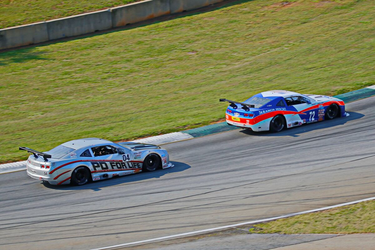 Shane Lewis in front of Kurt Roehrig